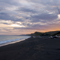 Fishing at sunset at Whakamahia Beach